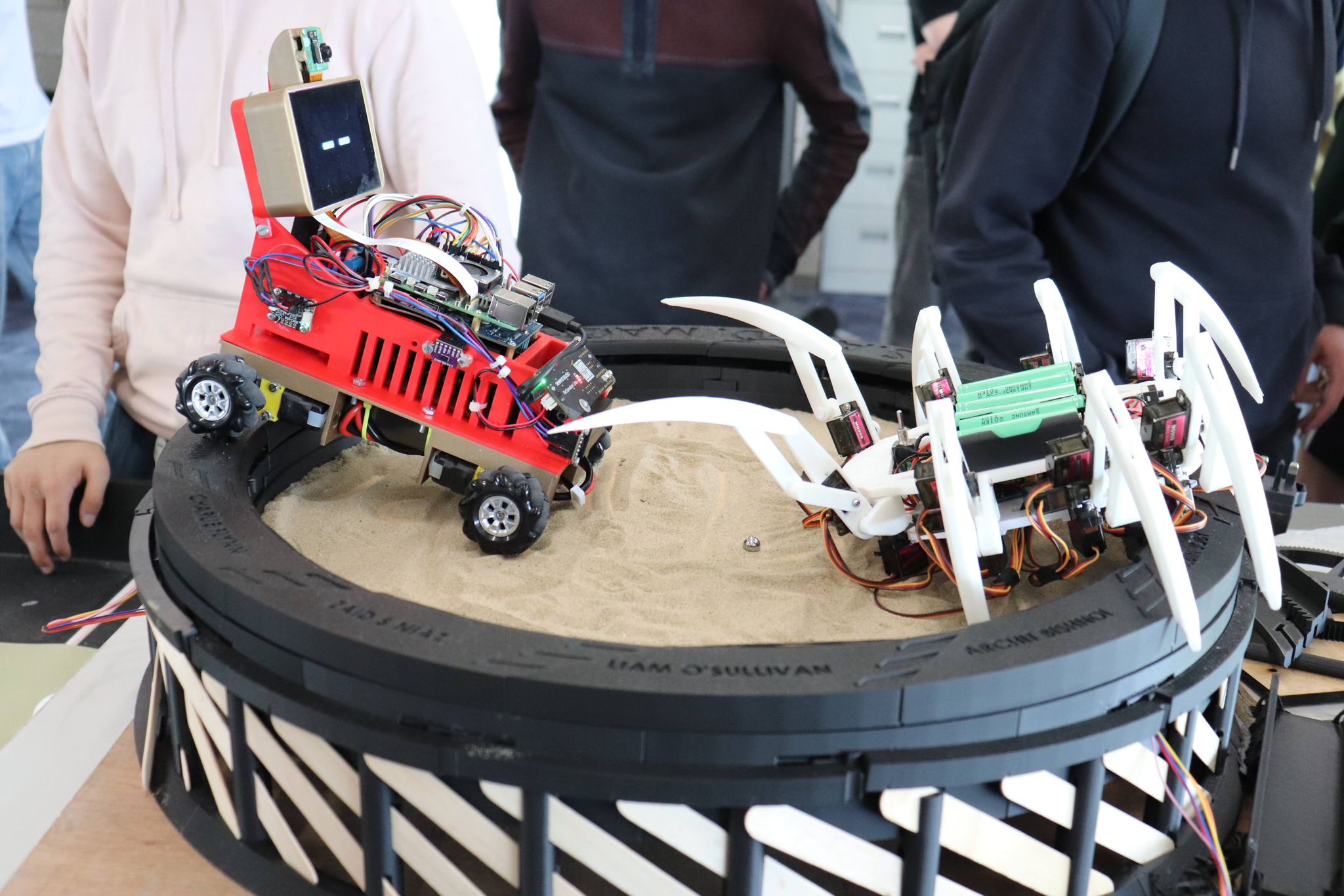 Jarvis on sand arena with spider robot