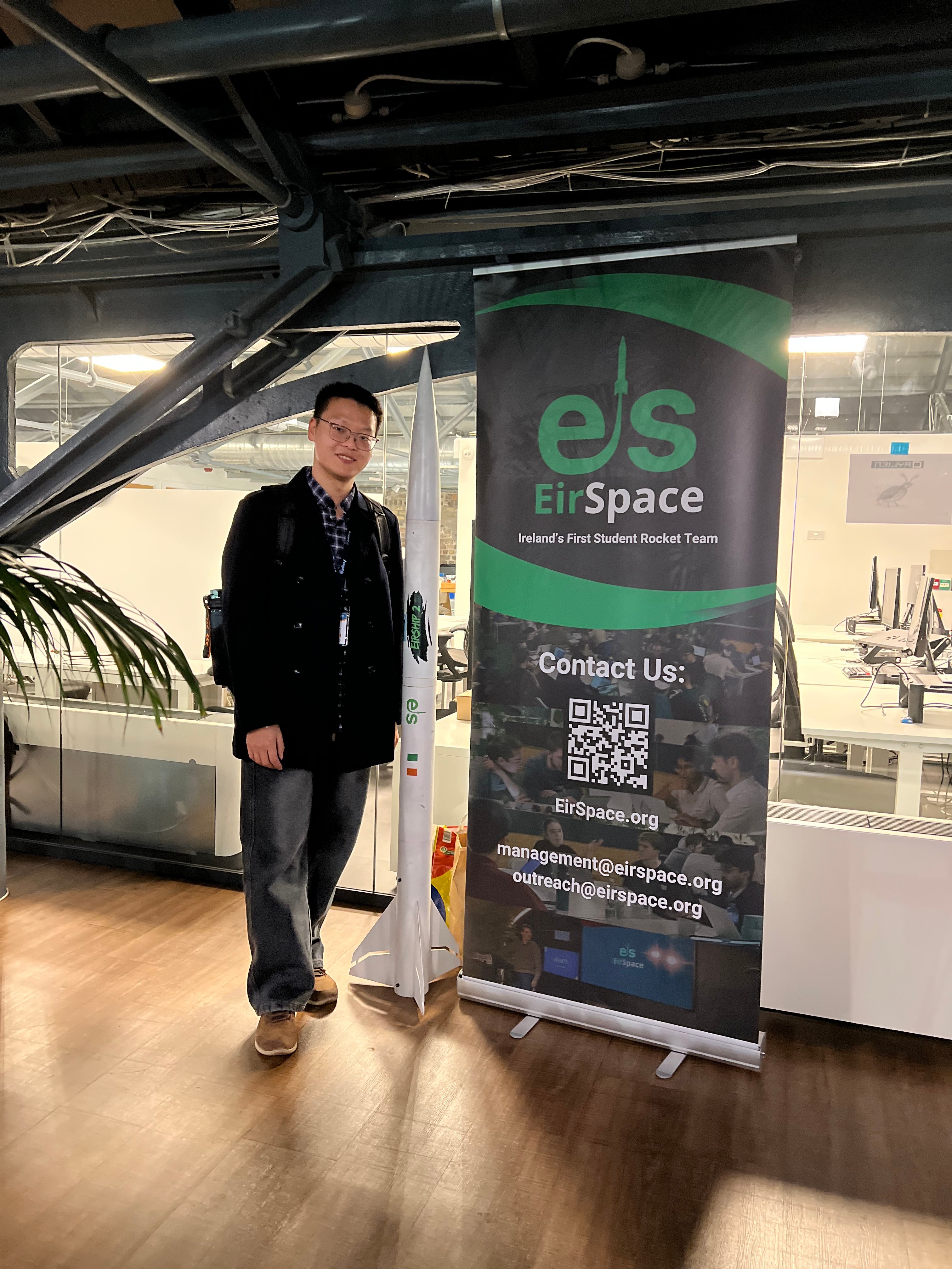 With EirSpace rocket and banner
